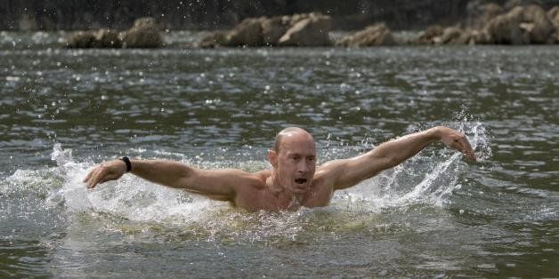 Russian Prime Minister Vladimir Putin swims the butterfly during his vacation outside the town of Kyzyl in Southern Siberia on August 3, 2009. AFP PHOTO / RIA-NOVOSTI / ALEXEY DRUZHININ (Photo credit should read ALEXEY DRUZHININ/AFP/Getty Images)