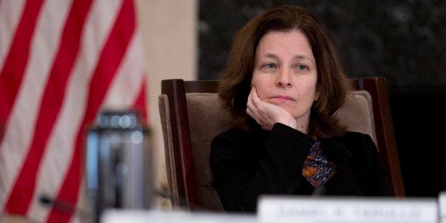 Sarah Bloom Raskin, governor of the U.S. Federal Reserve, listens during an open meeting of the Board of Governors of the Fed