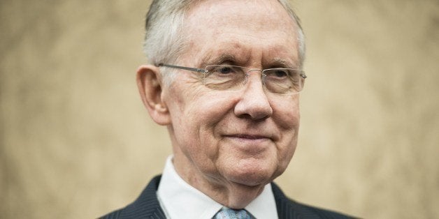 Senate Majority Leader Senator Harry Reid (D-NV) listens during an event on Capitol Hill on April 3, 2014 in Washington, DC. Senate Democrats were joined by US Secretary of Labor Thomas E. Perez and others to support a minimum wage raise from $7.25 to $10.10 an hour. AFP PHOTO/Brendan SMIALOWSKI (Photo credit should read BRENDAN SMIALOWSKI/AFP/Getty Images)