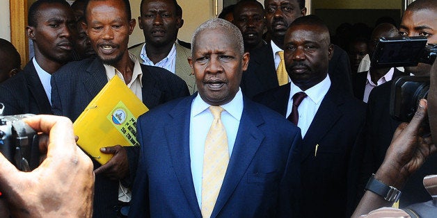 Ugandan Minister Sam Kutesa leaves the anti-corruption court in Kampala where he appeared alongside two other ministers to fa