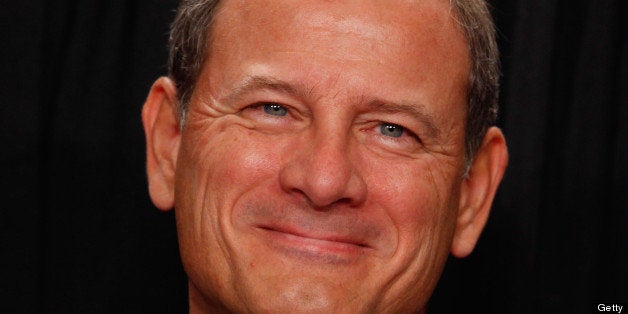 WASHINGTON - OCTOBER 08: U.S. Supreme Court Chief Justice John Roberts poses for photographs in the East Conference Room at the Supreme Court building October 8, 2010 in Washington, DC. This is the first time in history that three women are simultaneously serving on the court. (Photo by Chip Somodevilla/Getty Images)