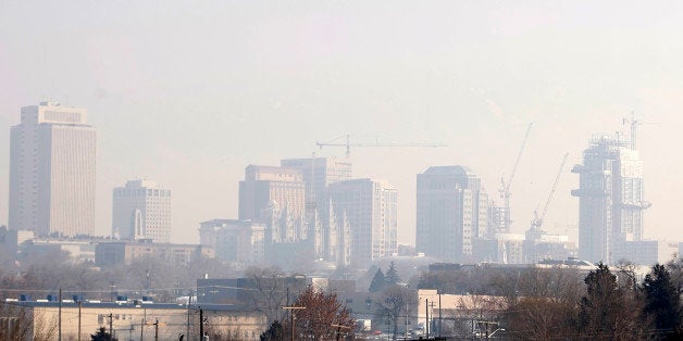 A Mormon Temple in downtown Salt Lake City is cast in heavy smog in Salt Lake City, Utah, U.S., on Monday, Jan. 11, 2010. In the Salt Lake City area during the winter, atmospheric inversions can trap pollutants such as ozone and carbon monoxide near ground level, producing a dense smoglike cover. Photographer: George Frey/Bloomberg via Getty Images