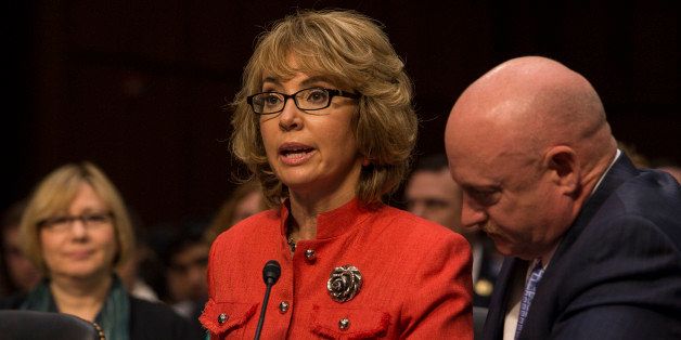 WASHINGTON, DC - JANUARY 30: Gabrielle Giffords with her husband Captain Mark Kelly at her side gives a brief statement before the Senate Judiciary Committee on gun control in Washington, D.C., on Wednesday, January 30, 2013. ?You must act. Be bold. Be courageous. Americans are counting on you.' told the Committee. (Photo by Nikki Kahn/The Washington Post via Getty Images)
