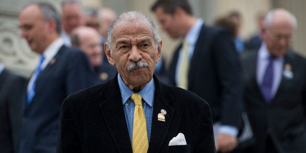 UNITED STATES - APRIL 4: Rep. John Conyers, D-Mich., looks for his ride as he leaves the Capitol following the last vote of the week on Friday, April 4, 2014. (Photo By Bill Clark/CQ Roll Call)
