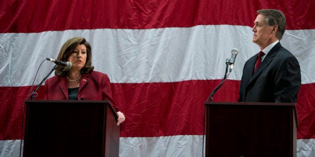 UNITED STATES - APRIL 19: Karen Handel, left, and David Perdue participate in the Republican candidates for Georgia's open U.S. Senate seat debate at the Columbia County Exhibition Center in Grovetown, Ga., outside of Augusta, on Saturday, April 19, 2014. (Photo By Bill Clark/CQ Roll Call)