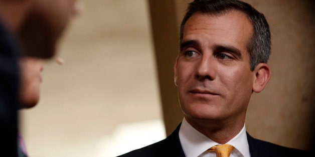 Eric Garcetti, mayor of Los Angeles, listens after an interview at the annual Milken Institute Global Conference in Beverly Hills, California, U.S., on Monday, April 28, 2014. The conference brings together hundreds of chief executive officers, senior government officials and leading figures in the global capital markets for discussions on social, political and economic challenges. Photographer: Patrick T. Fallon/Bloomberg via Getty Images 