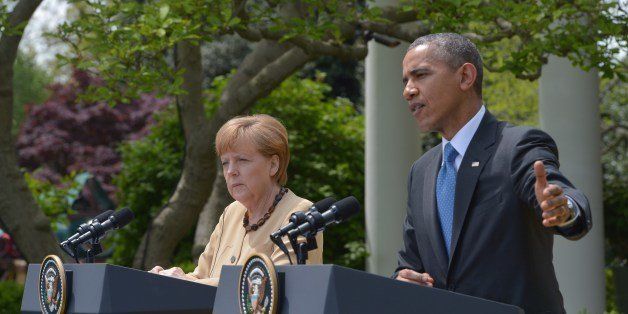 US President Barack Obama and German Chancellor Angela Merkel conduct a joint press conference in the Rose Garden of the White House on May 2, 2014 in Washington, DC. Obama welcomed Merkel to the White House Friday, seeking to secure united European backing for tougher sanctions on Russia's economy should the Kremlin escalate the crisis in Ukraine. AFP PHOTO/Mandel NGAN (Photo credit should read MANDEL NGAN/AFP/Getty Images)