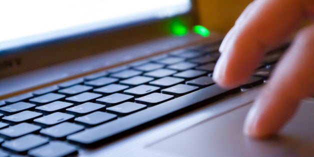 Woman typing on notebook