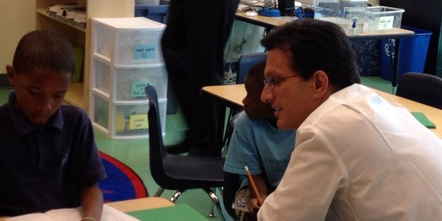 Rep Eric Cantor (R-Va), the author of a bill to replace the No ChildLeft Behind Act, talks to a student at Two Rivers Public CharterSchool in Washington D.C. on Tuesday, July 16, 2013. Kline's bill would reduce thefederal government oversight of K12 education. (Renee Schoof/MCT via Getty Images)