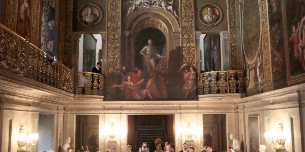 CHATSWORTH, ENGLAND - JUNE 22: Guests watch a display of regency dancing during the Pride and Prejudice Ball in the painted hall of Chatsworth House on June 22, 2013 in Chatsworth, England. To celebrate the 200th anniversary of the publication of Jane Austen's Pride and Prejudice Chatsworth stately home staged a regency costume evening. Chatsworth House is believed to be the inspiration for Pemberley, the residence of Mr. Darcy. Austen based her idea of Pemberley on Chatsworth House as she wrote the novel in nearby Bakewell in 1812. Chatsworth also featured in the 2005 Pride and Prejudice movie starring Kiera Knightley (Photo by Christopher Furlong/Getty Images)