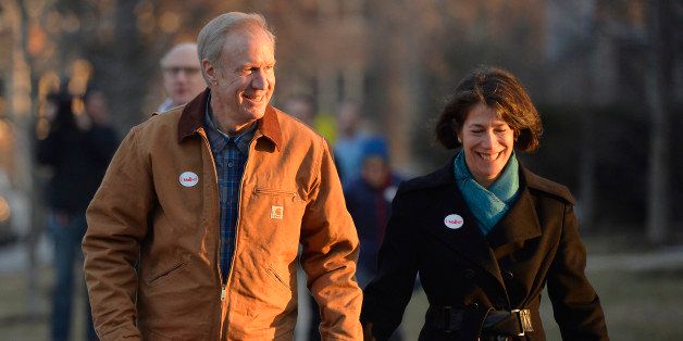 WINNETKA, IL - MARCH 18: Republican Gubernatorial Candidate Bruce Rauner (L) and his wife Diana walk home after voting in the Illinois primary election on March 18, 2014 in Winnetka, Illinois. Rauner, a private equity manager, faces off against State Senator Bill Brady, State Treasurer Dan Rutherford and State Senator Kirk Dillard in the Republican primary. (Photo by Brian Kersey/Getty Images)