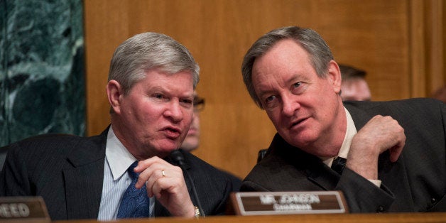 UNITED STATES - FEBRUARY 27: Chairman Tim Johnson, D-S.D., left, and Sen. Mike Crapo, R-Idaho, ranking member, conduct Senate Banking, Housing and Urban Affairs Committee hearing in Dirksen Building titled the 'Semiannual Monetary Policy Report to the Congress.' Janet Yellen, Chairman of the Federal Reserve, testified. (Photo By Tom Williams/CQ Roll Call)