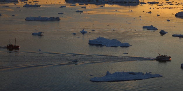 ILULISSAT, GREENLAND - JULY 23: Ships are seen among the icebergs that broke off from the Jakobshavn Glacier as the sun reaches its lowest point of the day on July 23, 2013 in Ilulissat, Greenland. As the sea levels around the globe rise, researchers affilitated with the National Science Foundation and other organizations are studying the phenomena of the melting glaciers and its long-term ramifications. The warmer temperatures that have had an effect on the glaciers in Greenland also have altered the ways in which the local populace farm, fish, hunt and even travel across land. In recent years, sea level rise in places such as Miami Beach has led to increased street flooding and prompted leaders such as New York City Mayor Michael Bloomberg to propose a $19.5 billion plan to boost the citys capacity to withstand future extreme weather events by, among other things, devising mechanisms to withstand flooding. (Photo by Joe Raedle/Getty Images)