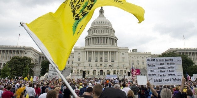 Demonstrators with the Tea Party protest the Internal Revenue Service (IRS) targeting of the Tea Party and similar groups dur