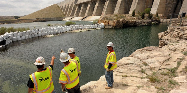 Crews look over the bank of the Arkansas River at the base of the dam of the Pueblo Reservoir, Wednesday, May 18, 2011, are where work has started on construction of a 62-mile pipeline to divert Arkansas River water trapped in Pueblo Reservoir to sustain future growth in Colorado Springs and other Front Range communities. This will be the state's biggest water project in decades costing more than $1 billion. RJ Sangosti, The Denver Post (Photo By RJ Sangosti/The Denver Post via Getty Images)