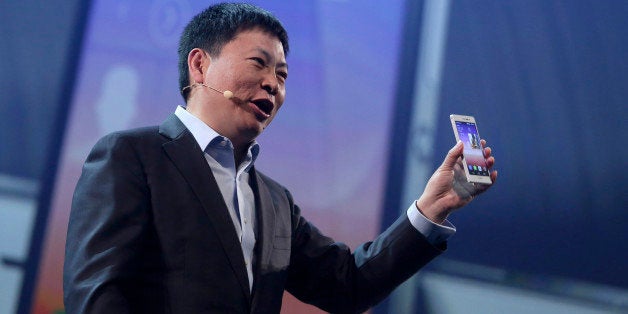 Richard Yu, head of consumer business for Huawei Technologies Co., holds the company's Ascend P7 smartphone during the handset's global launch in Paris, France, on Wednesday, May 7, 2014. Huawei Technologies, China's biggest maker of phone-network equipment, is focusing investments on countries in which it has been accepted, because of lingering suspicions in the U.S. about its motives. Photographer: Chris Ratcliffe/Bloomberg via Getty Images 