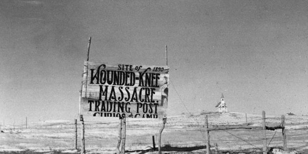 November 1940: A sign at the site of the Wounded Knee Massacre, South Dakota, where 250 American Indians were killed in 1890. (Photo by John Vachon/Library Of Congress/Getty Images)