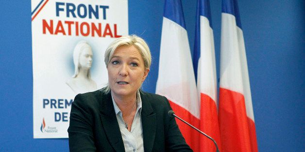 NANTERRE, FRANCE - MAY 27: French far-right party National Front (FN) president Marine Le Pen delivers a speech during a press conference at the party's headquarters on May 27, 2014 in Nanterre, France. National Front (FN) won European elections in France with 25 % of votes cast. (Photo by Chesnot/Getty Images)
