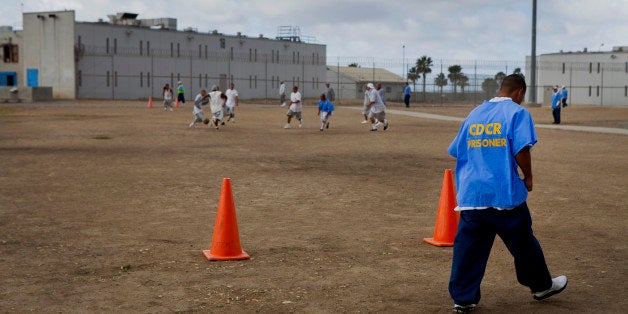 Inmates play soccer in the yard at the Richard J. Donovan Correctional Facility in San Diego, California, U.S., on Wednesday, March 26, 2014. California is under a federal court order to lower the population of its prisons to 137.5 percent of their designed capacity after the U.S. Supreme Court upheld a ruling that inmate health care was so bad it amounted to cruel and unusual punishment. Photographer: Sam Hodgson/Bloomberg via Getty Images