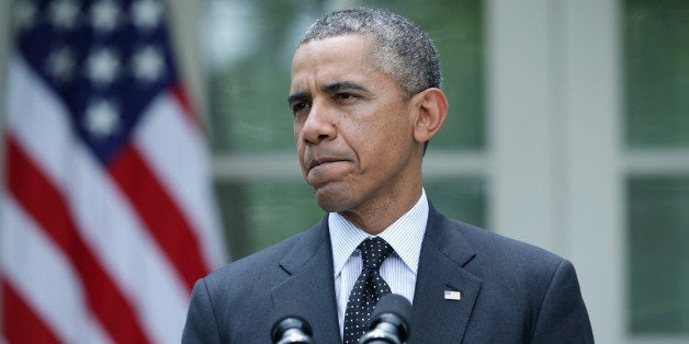 WASHINGTON, DC - MAY 27: U.S. President Barack Obama pauses as he makes a statement about military troop pullout from Afghanistan at the Rose Garden of the White House on May 27, 2014 in Washington, DC. The administration's plan is to keep a contingency force of 9,800 U.S. troops in Afghanistan beyond 2014, consolidating them in Kabul and on Bagram Air Base. (Photo by Alex Wong/Getty Images)