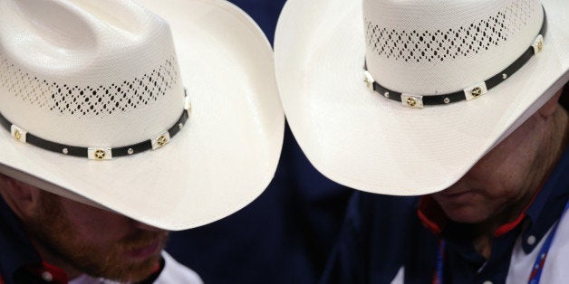 TAMPA, FL - AUGUST 28: Delegates from Texas wear cowboy hats during the Republican National Convention at the Tampa Bay Times Forum on August 28, 2012 in Tampa, Florida. Today is the first full session of the RNC after the start was delayed due to Tropical Storm Isaac. (Photo by Win McNamee/Getty Images)