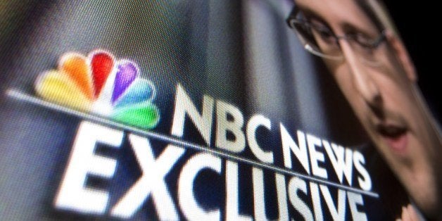 A photo illustration shows a part of a TV screen with the TV network NBC News logo taken in Washington,DC on May 28, 2014, during their exclusive interview by Brian williams with Edward Snowden. Fugitive self-proclaimed spy Edward Snowden said Wednesday he wants to return home, as he defended his massive leak of US intelligence secrets, saying abuses of constitutional rights left him no choice. AFP PHOTO/MLADEN ANTONOV (Photo credit should read MLADEN ANTONOV/AFP/Getty Images)