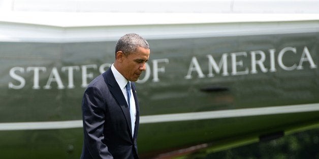 US President Barack Obama walks to the Oval Office at the White House in Washington, DC, on May 28, 2014 upon returning from
