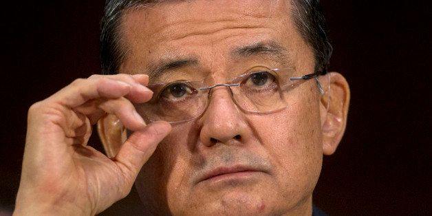 Eric Shinseki, U.S. secretary of Veterans Affairs (VA), adjusts his glasses during a Senate Veterans' Affairs Committee hearing in Washington, D.C., U.S., on Thursday, May 15, 2014. Shinseki said he is 'mad as hell' over allegations of treatment delays and cover-ups at VA health clinics in Phoenix and Fort Collins, Colorado. Photographer: Andrew Harrer/Bloomberg via Getty Images 