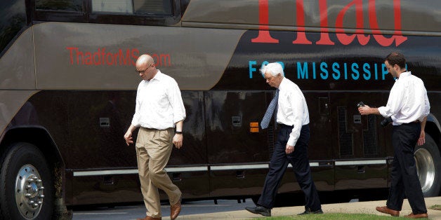 UNITED STATES - MAY 30: Sen. Thad Cochran, R-Miss., and his staff make their way to their bus after a tour of City Hall in Olive Branch, Miss., May 30, 2014. (Photo By Tom Williams/CQ Roll Call)