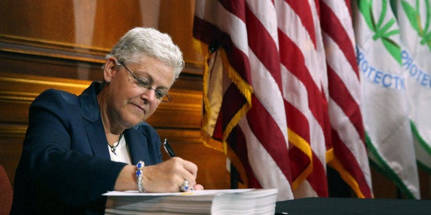 WASHINGTON, DC - JUNE 02: U.S. Environmental Protection Agency Administrator Gina McCarthy signs new regulations for power p