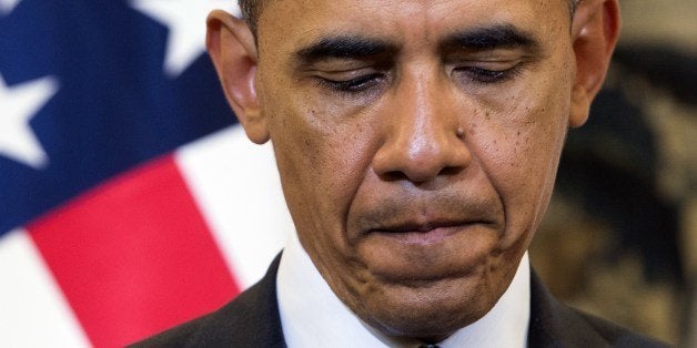 US President Barack Obama reacts during a joint press conference following meetings with Polish President at Belweder Palace in Warsaw, Poland, June 3, 2014. Obama arrived for a two-day Polish visit, the first stop on a European trip, and will discuss the Ukraine crisis with his central and eastern European counterparts. AFP PHOTO / Saul LOEB (Photo credit should read SAUL LOEB/AFP/Getty Images)