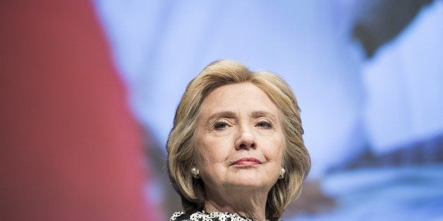 Former Secretary of State Hillary Clinton waits to speak at the World Bank May 14, 2014 in Washington, DC. Clinton and World