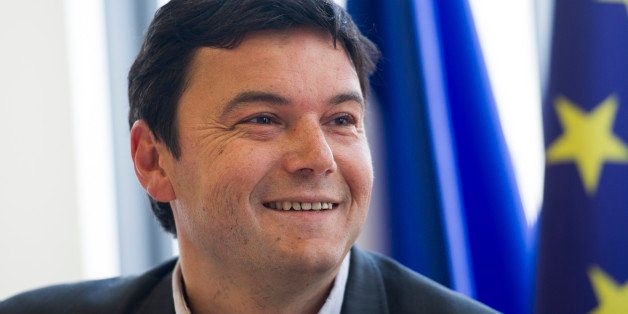 French economist Thomas Piketty smiles during a meeting at the National Assembly on March 13, 2013 in Paris. AFP PHOTO / FRED DUFOUR (Photo credit should read FRED DUFOUR/AFP/Getty Images)