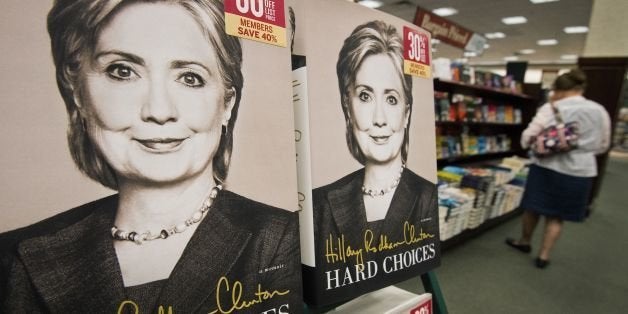 Copies of former US Secretary of State Hillary Clinton's new book, 'Hard Choices' are viewed for sale at the Barnes & Noble Booksellers store June 10, 2014, in Fairfax, Virginia. Hillary Clinton launched her much-anticipated book tour Tuesday and tried to smooth over a flap over her earlier remark that she and her husband Bill were 'dead broke' when they left the White House. AFP PHOTO/Paul J. Richards (Photo credit should read PAUL J. RICHARDS/AFP/Getty Images)