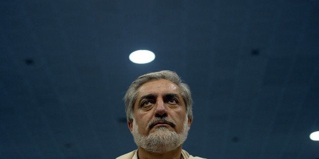 Afghan presidential candidate Abdullah Abdullah attends a gathering on the last day of campaigning in Kabul on June 11, 2014. Afghanistan's election will go to a run-off vote between former foreign minister Abdullah Abdullah and ex-World Bank economist Ashraf Ghani, results confirmed, as the country enters a new era without NATO combat troops. The head-to-head election, scheduled for June 14, will choose a successor to President Hamid Karzai in Afghanistan's first democratic transfer of power. AFP PHOTO/SHAH Marai (Photo credit should read SHAH MARAI/AFP/Getty Images)