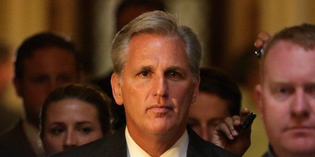 WASHINGTON, DC - JUNE 11: U.S. House Majority Whip Rep. Kevin McCarthy (R-CA) (C) passes through the Statuary Hall of the Capitol after a vote on the House floor June 11, 2014 on Capitol Hill in Washington, DC. House Majority Leader Rep. Eric Cantor (R-VA) has lost his Virginia primary to Tea Party challenger Dave Brat in the night before, opening up a slot for Majority Leader. (Photo by Alex Wong/Getty Images)