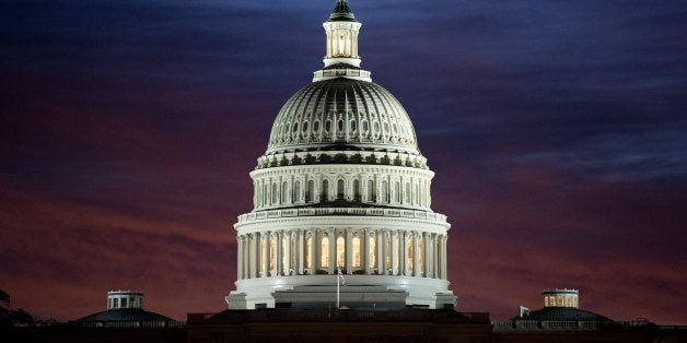 The US Capitol dome is seen at sunrise over Washington, DC, September 25, 2013. The US Senate faces a Sunday showdown over wh