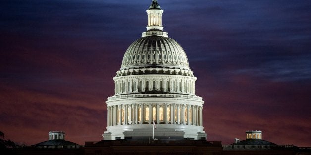 The US Capitol dome is seen at sunrise over Washington, DC, September 25, 2013. The US Senate faces a Sunday showdown over whether to keep government running, but bickering over US President Barack Obama's signature health care law is bringing federal agencies dangerously close to a shutdown. A fractured Congress is struggling to approve a stopgap spending bill that keeps government doors open after the current fiscal year ends next Monday. AFP PHOTO / Saul LOEB (Photo credit should read SAUL LOEB/AFP/Getty Images)