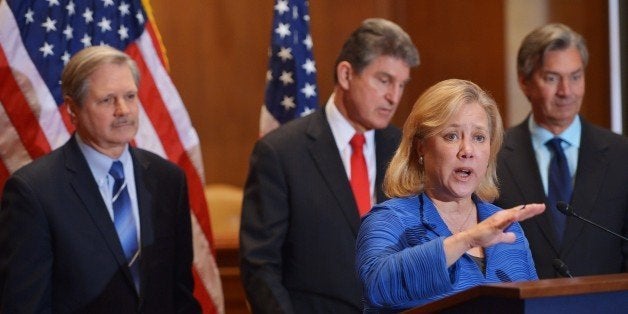 Senator Mary Landrieu (2nd R), D-LA, speaks during a a press conference on the Keystone XL pipeline in the Dirksen Senate Office Building on February 4, 2014 in Washington, DC. Looking on are (from left): Sentor John Hoeven, R-ND, Senator Joe Manchin, D-WV, and Canada's Ambassador to the US Gary Doer. AFP PHOTO/Mandel NGAN (Photo credit should read MANDEL NGAN/AFP/Getty Images)