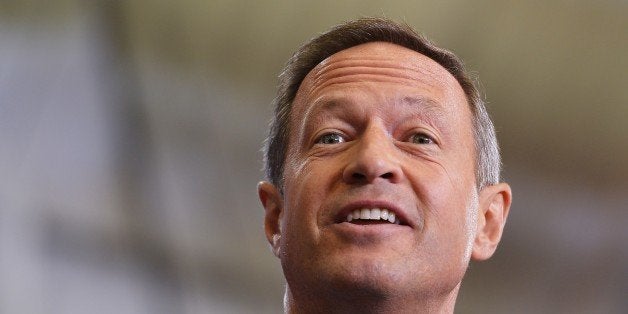 Maryland Governor Martin O'Malley introduces US President Barack Obama at Prince Georges Community College on September 26, 2