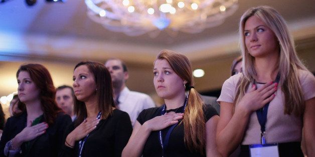WASHINGTON, DC - JUNE 20: People stand for the singing of the national anthem during the Faith and Freedom Coalition's 'Road to Majority' Policy Conference at the Omni Shoreham hotel June 20, 2014 in Washington, DC. Led by the Christian political activist Ralph Reed, the coalition heard from conservative politicians who are courting religious conservatives as they eye a run for the White House. (Photo by Chip Somodevilla/Getty Images)