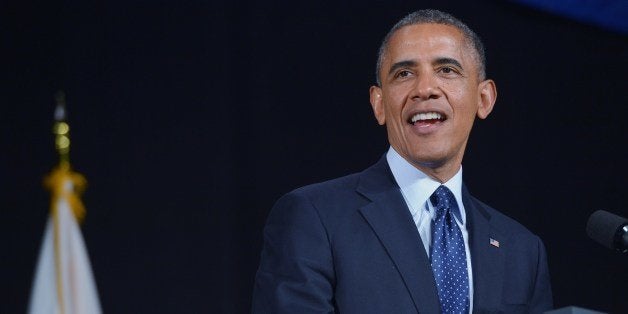 US President Barack Obama delivers the commencement address during a ceremony at Worcester Technical High School on June 11, 2014 in Worcester, MA. AFP PHOTO/Mandel NGAN (Photo credit should read MANDEL NGAN/AFP/Getty Images)