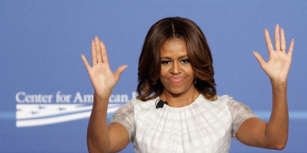 WASHINGTON, DC - JUNE 23: U.S. first lady Michelle Obama participates in the White House Summit On Working Families at the Omni Shoreham hotel June 23, 2014 in Washington, DC. Organized by the White House, the Labor Department and the Center for American Progress, the summit explored ideas like paid sick, maternity leave and universal preschool. President Obama on Monday ordered federal departments and agencies 'to expand flexible workplace policies to the maximum extent possible,' with an eye toward improving flexibility for parents. (Photo by Chip Somodevilla/Getty Images)