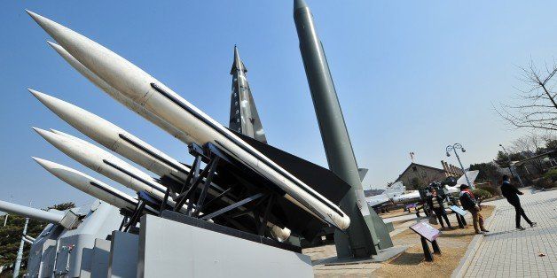 Visitors walk past replicas of a North Korean Scud-B missile (R) and South Korean Hawk surface-to-air missiles (L) at the Korean War Memorial in Seoul on March 3, 2014. North Korea fired short-range missiles into the sea off its eastern coast for the second time in a week on March 3, prompting a warning from South Korea of 'reckless provocation.' AFP PHOTO / JUNG YEON-JE (Photo credit should read JUNG YEON-JE/AFP/Getty Images)