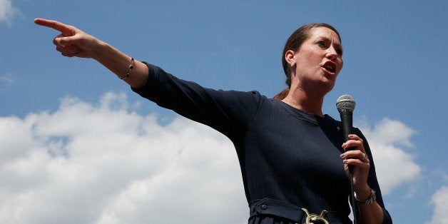 COVINGTON, KY - MAY 18: U.S. Senate candidate and Kentucky Secretary of State Alison Lundergan Grimes (D-KY) campaigns in advance of the state's Democratic primary May 18, 2014 at the Maifest festival in Covington, Kentucky. A recent 'Bluegrass Poll' by the Louisville Courier-Journal showed Grimes in a virtual tie with the incumbent, Senate Republican Leader Mitch McConnell (R-KY). (Photo by Win McNamee/Getty Images)