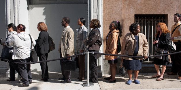 Job seekers wait on line outside the Metropolitan Pavilion before the start of a job fair in New York, U.S., on Sunday, Oct. 2, 2011. U.S. President Barack Obama 's $447 billion jobs plan would help avoid a return to recession by maintaining growth and pushing down the unemployment rate next year. Photographer: Emile Wamsteker/Bloomberg via Getty Images