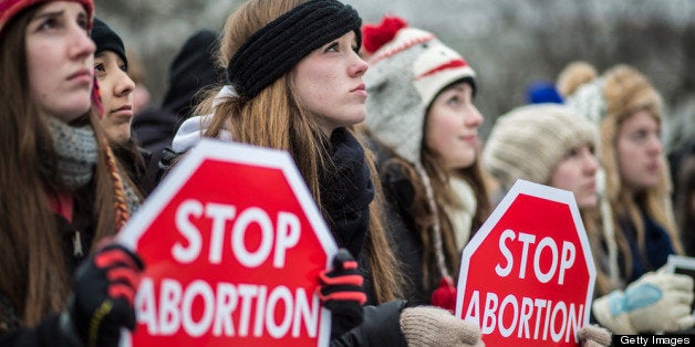 WASHINGTON, DC - JANUARY 25: Anti-abortion protesters attend the March for Life on January 25, 2013 in Washington, DC. The pro-life gathering is held each year around the anniversary of the Roe v. Wade Supreme Court decision. (Photo by Brendan Hoffman/Getty Images)