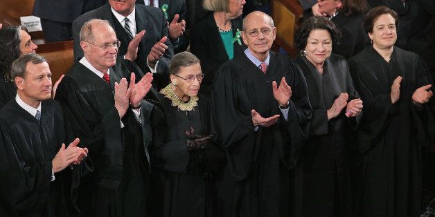 WASHINGTON, DC - FEBRUARY 12: Members of the Supreme Court, (L-R) Chief Justice John Roberts and associate justices Anthony Kennendy, Ruth Bader Ginsburg, John Paul Stevens, Sonia Sotomayor and Elena Kagan, applaud as U.S. President Barack Obama arrives to deliver his State of the Union speech before a joint session of Congress at the U.S. Capitol February 12, 2013 in Washington, DC. Facing a divided Congress, Obama focused his speech on new initiatives designed to stimulate the U.S. economy and said, 'ItÃs not a bigger government we need, but a smarter government that sets priorities and invests in broad-based growth'. (Photo by Chip Somodevilla/Getty Images)