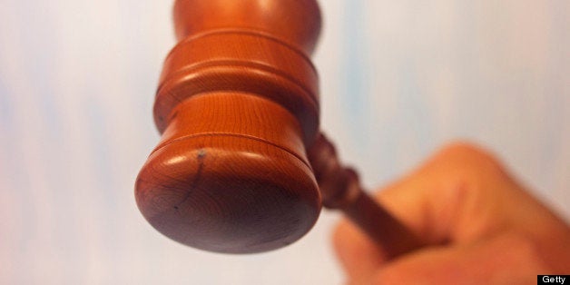 Justice or judgement a raised gavel about to strike. Sale at the end of an auction. Differential focus, limited depth of fiel