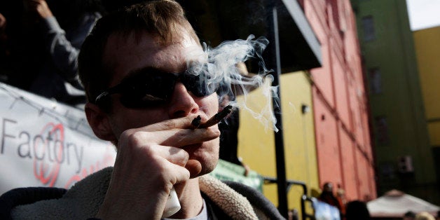 SEATTLE, WA - APRIL 20: Anthony Nitowski smokes two joints outside at Hempfest on April 20, 2014 in Seattle, Washington. Seattle Hempfest is an annual event for the purpose of educating the public about the benefits of marijuana and advocating for its decriminalization. (Photo by Meg Roussos/Getty Images)